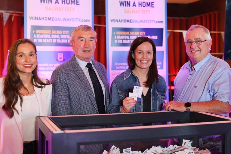 Jacqueline O’Gorman holding winning ticket 08549 at the Win a Home Galway City draw in Keane’s, Oranmore